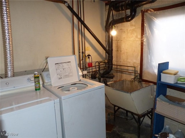 laundry area featuring separate washer and dryer and sink