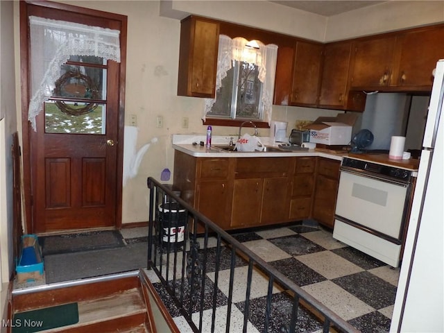 kitchen with sink and white appliances