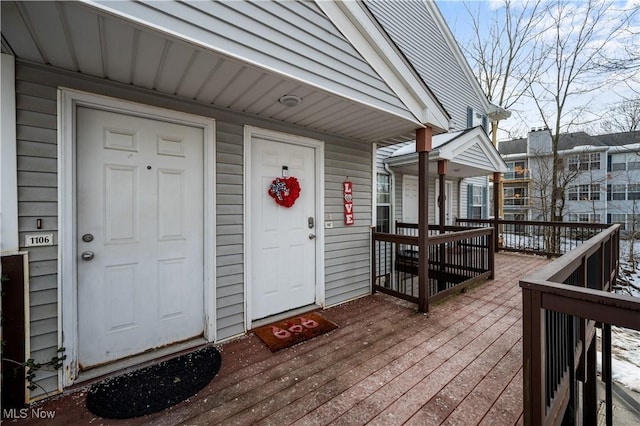 doorway to property with a wooden deck