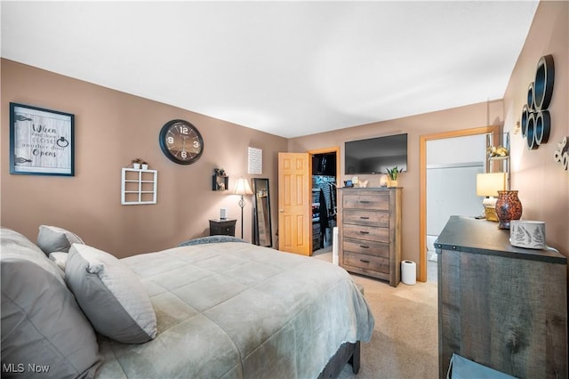 bedroom featuring light colored carpet