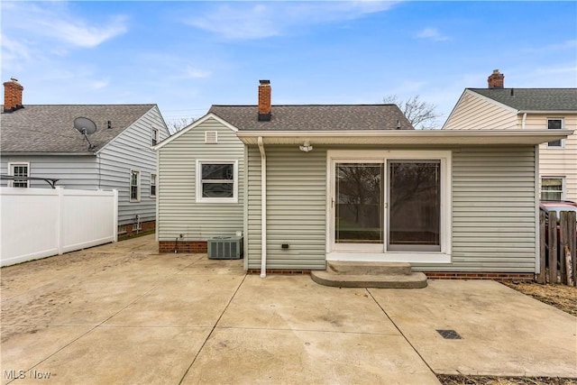 back of property featuring central AC and a patio