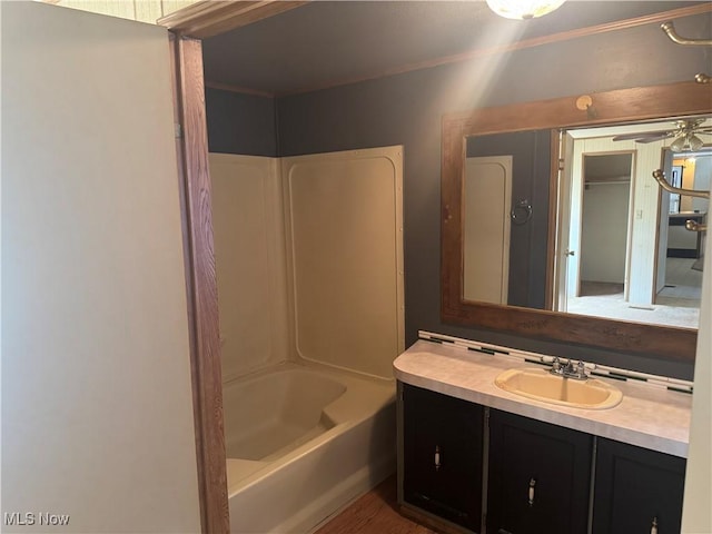 bathroom featuring vanity and tub / shower combination