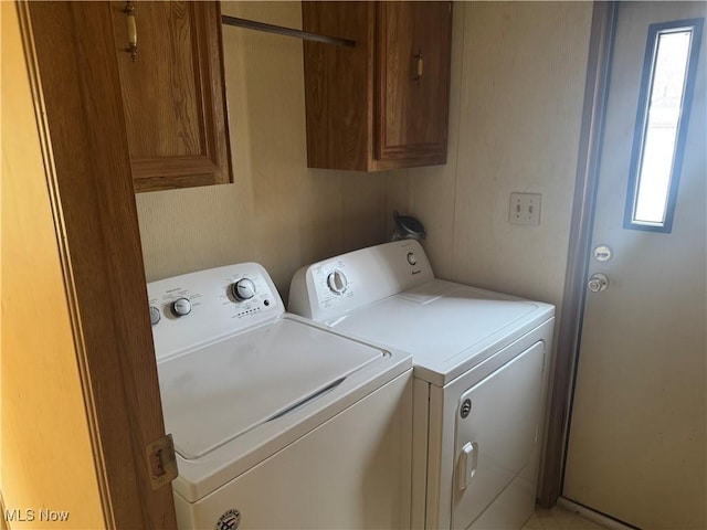 laundry room with cabinets and separate washer and dryer