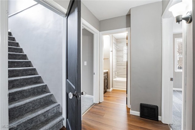 stairway with wood-type flooring