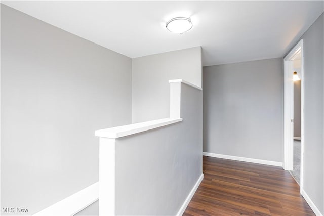 corridor featuring dark hardwood / wood-style floors