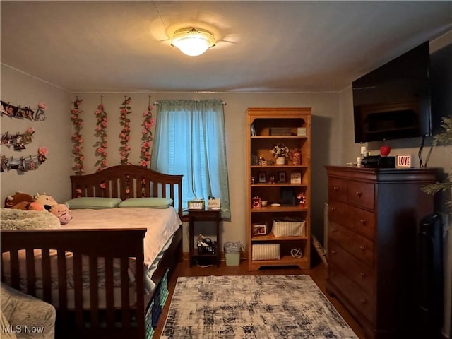 bedroom featuring dark hardwood / wood-style floors