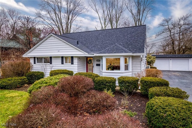 view of front of home with an outbuilding and a garage