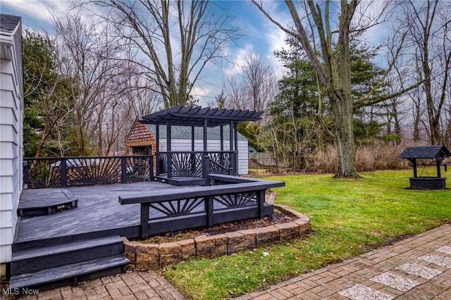 wooden terrace with a lawn