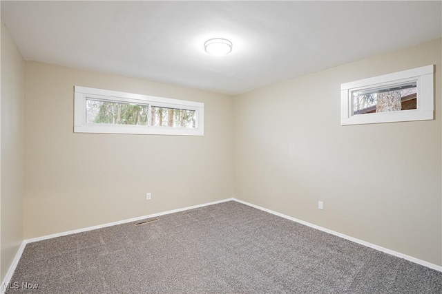 unfurnished room with carpet flooring