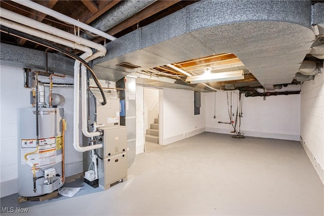 basement with water heater and heating unit