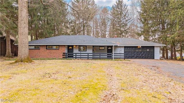 ranch-style house featuring a garage