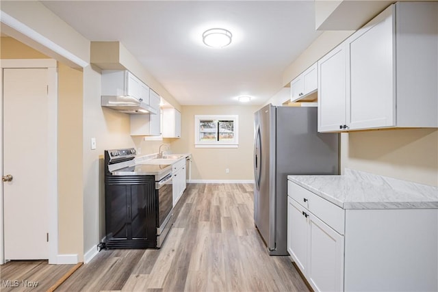 kitchen featuring stainless steel appliances, sink, white cabinets, and light hardwood / wood-style flooring