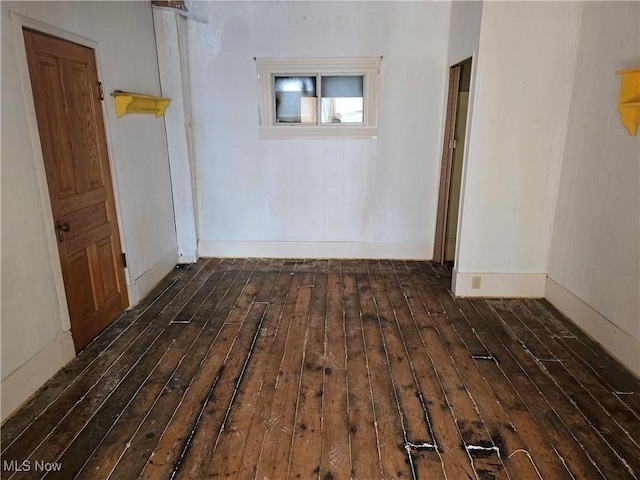 hall with dark hardwood / wood-style floors