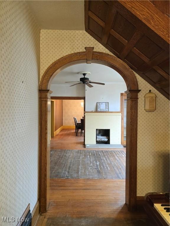 interior space featuring lofted ceiling, hardwood / wood-style floors, and ceiling fan