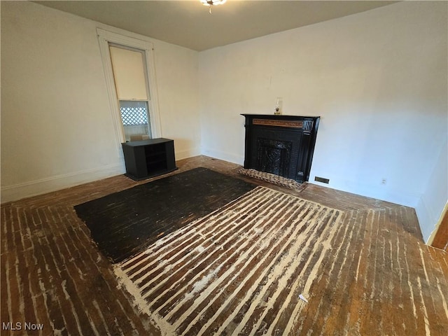 unfurnished bedroom featuring dark hardwood / wood-style flooring