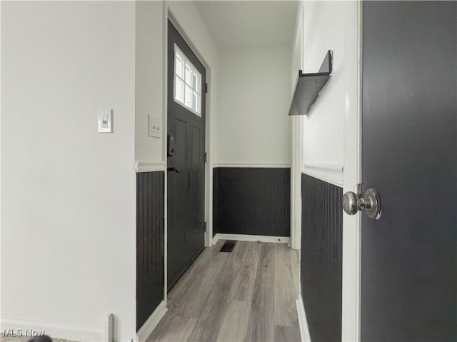 doorway to outside featuring hardwood / wood-style flooring