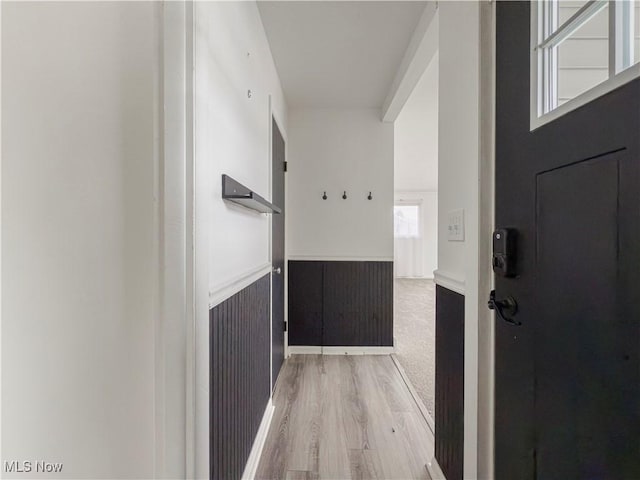 corridor featuring hardwood / wood-style floors