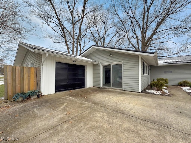 view of property exterior with a garage