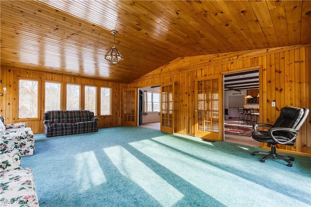 unfurnished living room featuring wood ceiling, wooden walls, vaulted ceiling, and carpet flooring