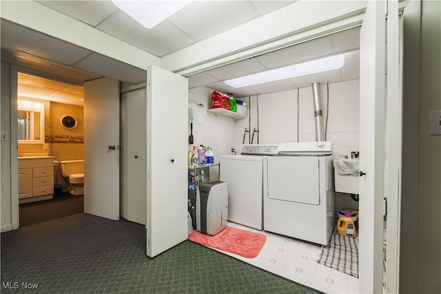 laundry area with washing machine and clothes dryer