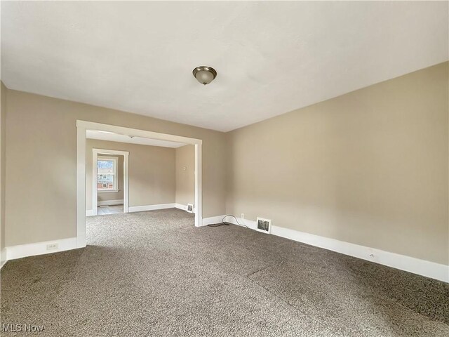 unfurnished room with carpet flooring