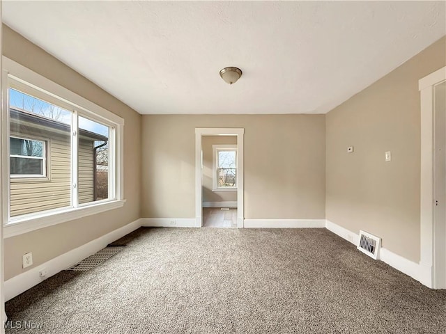 unfurnished room featuring carpet floors