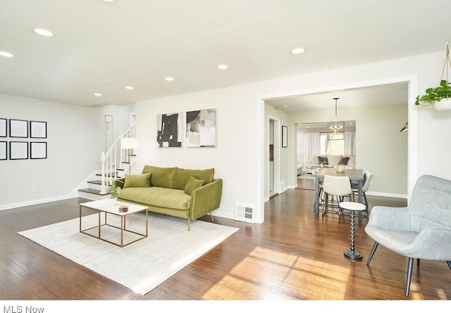 living room featuring dark wood-type flooring