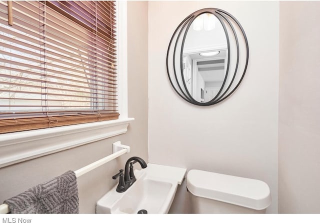 bathroom with toilet and sink