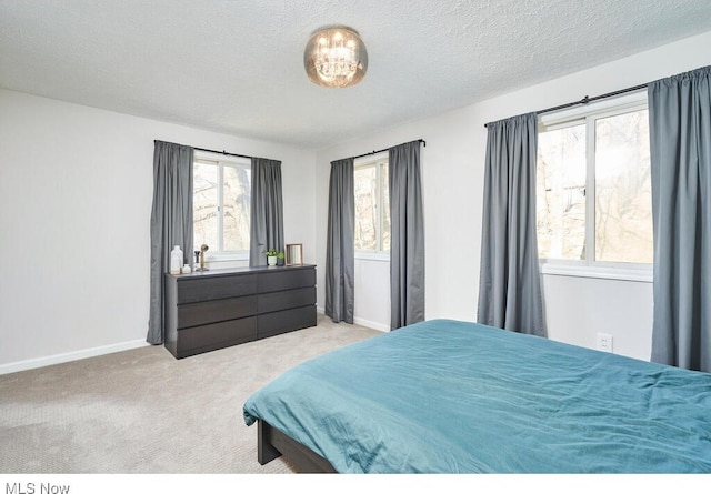 carpeted bedroom with a textured ceiling