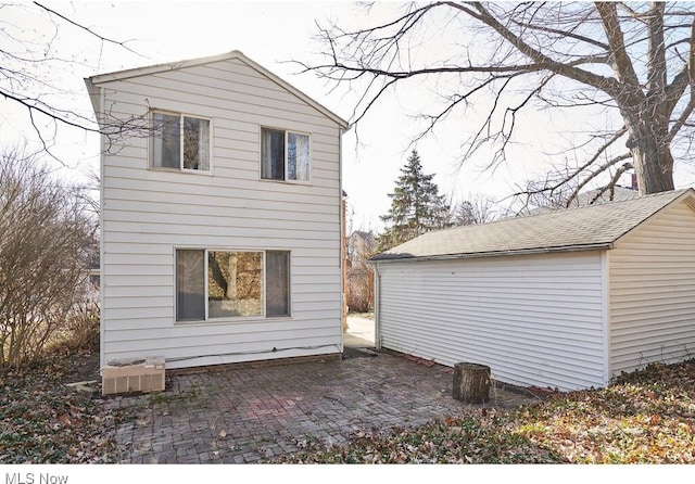 view of side of property featuring a patio