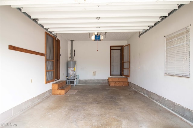 garage featuring a garage door opener and gas water heater