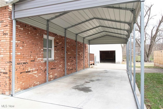 view of vehicle parking with a carport and a garage