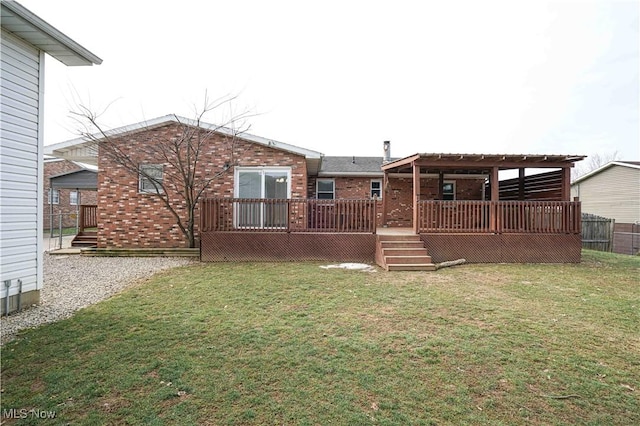 back of property featuring a yard and a deck