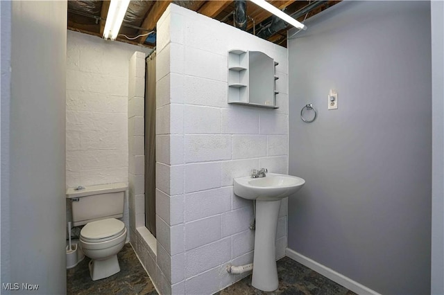 bathroom featuring toilet and sink