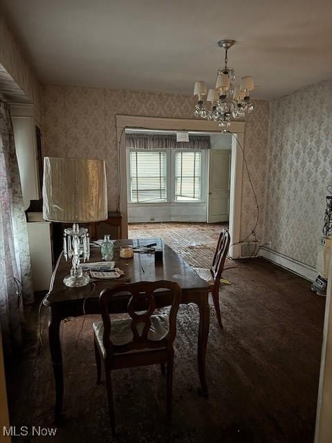 dining space featuring a chandelier