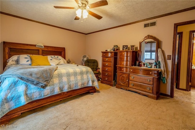 carpeted bedroom with crown molding, ceiling fan, and a textured ceiling