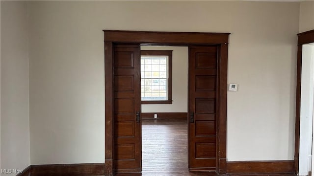 hall with dark hardwood / wood-style floors