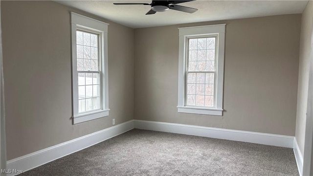 unfurnished room featuring ceiling fan and carpet