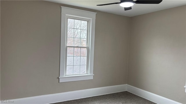 empty room featuring carpet floors and ceiling fan