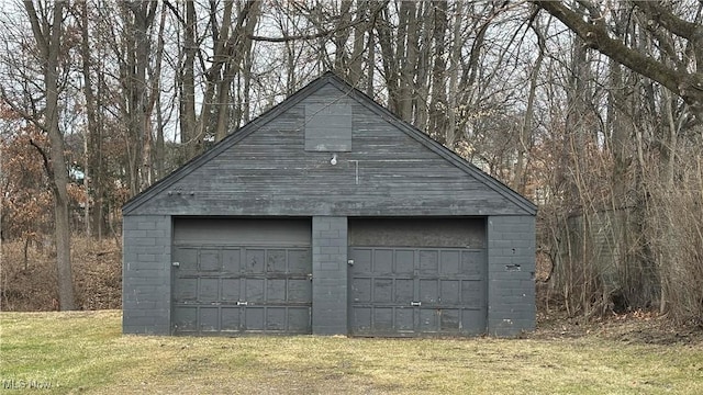 garage with a yard