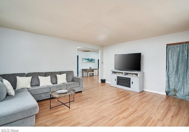 living room with light hardwood / wood-style flooring