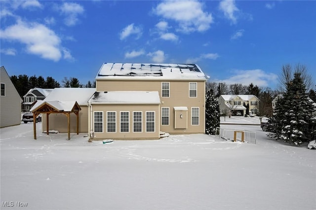 view of snow covered house