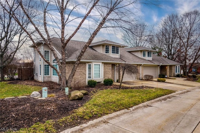 front of property featuring a garage and a front yard