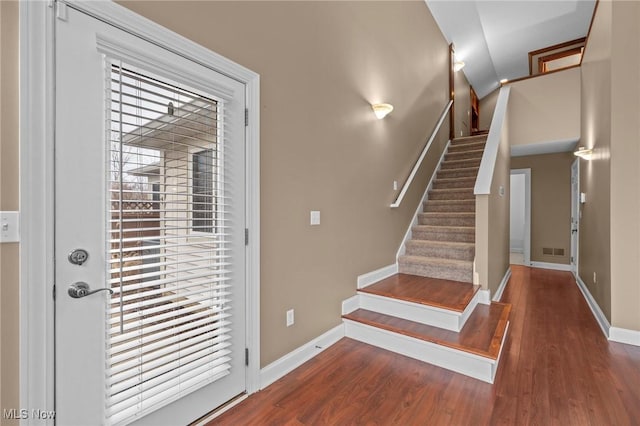 doorway to outside featuring dark wood-type flooring