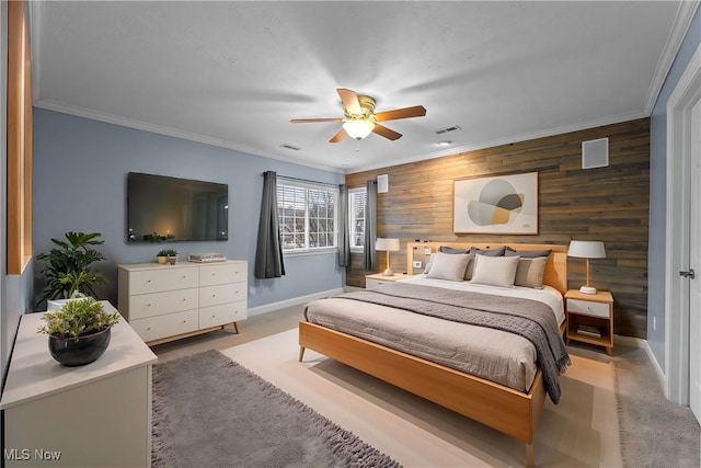 bedroom featuring light carpet, ornamental molding, and ceiling fan