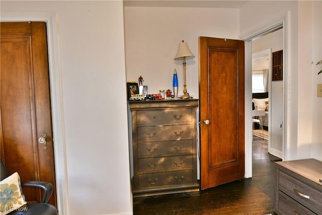 bedroom with dark hardwood / wood-style flooring