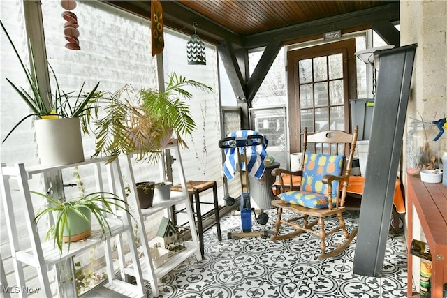 sunroom / solarium featuring wood ceiling