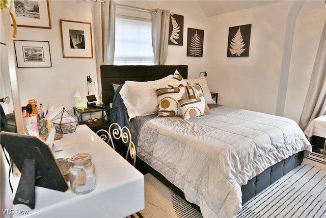 bedroom with vaulted ceiling