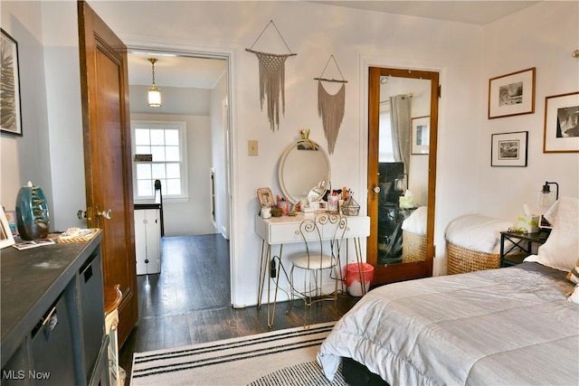 bedroom featuring dark hardwood / wood-style flooring