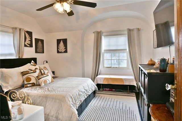 bedroom with ceiling fan and vaulted ceiling